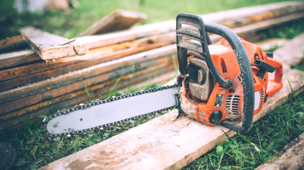 close-up view of chainsaw, construction tools, agriculture details. Gardening equipmentfeatured image